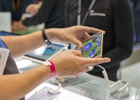 KIEV, UKRAINE - OCTOBER 07, 2017: Unrecognized people visit Lenovo, a Chinese multinational technology company booth during CEE 2017, the largest electronics trade show of Ukraine in KyivExpoPlaza EC.のeditorial素材