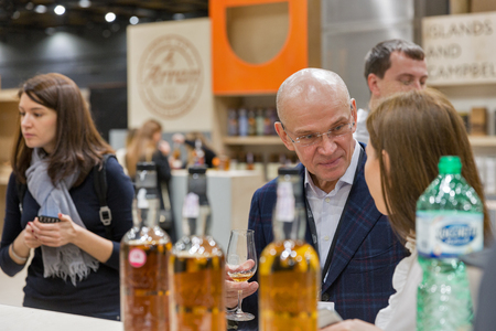 KIEV, UKRAINE - NOVEMBER 25, 2017: Unrecognized people tasting Single Malt Scotch Whisky at 3rd Ukrainian Whisky Dram Festival in Parkovy Exhibition Center.のeditorial素材