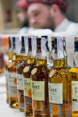 KIEV, UKRAINE - NOVEMBER 25, 2017: Glenlivet Single Malt Scotch Whisky Highland distillery booth at 3rd Ukrainian Whisky Dram Festival in Parkovy Exhibition Center.のeditorial素材