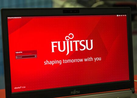 KIEV, UKRAINE - OCTOBER 07, 2017: Logo Fujitsu closeup, a Japanese multinational information technology equipment and services company booth at CEE 2017, electronics trade show in KyivExpoPlaza EC.のeditorial素材
