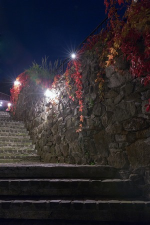 Dark scene with night medieval stairs and street lights in Banska Stiavnica, Slovakia.の写真素材