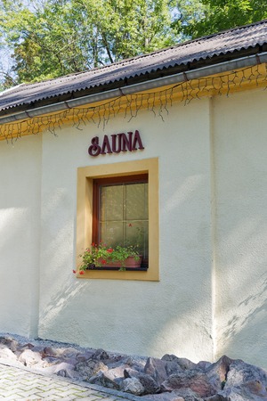 Sauna sign outdoor on building wall with windowの写真素材