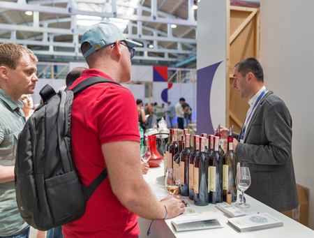 KIEV, UKRAINE - JUNE 02, 2018: Man sommelier presents Georgian wine at Kyiv Wine Festival. 77 winemakers from around the world took part in the big festival organized by Good Wine company.のeditorial素材