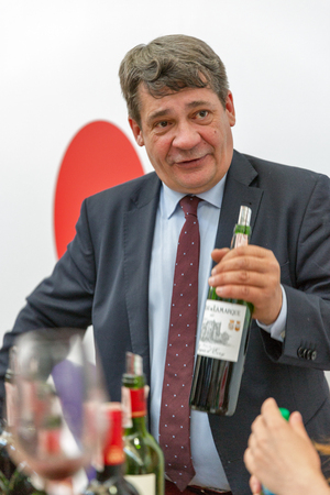 KIEV, UKRAINE - JUNE 02, 2018: Man sommelier presents its wine at Kyiv Wine Festival. Big festival of wine organized by Good Wine company, 77 winemakers from around the world took part there.のeditorial素材