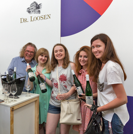 KIEV, UKRAINE - JUNE 02, 2018: Man sommelier presents its Dr. Loosen wine at Kyiv Wine Festival booth. 77 winemakers from around the world took part big festival organized by Good Wine company.のeditorial素材