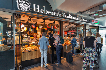 BERLIN, GERMANY - JULY 13, 2018: Unrecognized people buy pastries in Heberer's Traditional Bakery stall on Central Passenger Railway Station or Hauptbahnhof.のeditorial素材