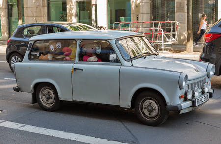 BERLIN, GERMANY - JULY 13, 2018: Retro car Trabant full of cute dolls inside in Mitte central district. It is an automobile which was produced in 1957-1990 by former East German car manufacturer VEB.のeditorial素材