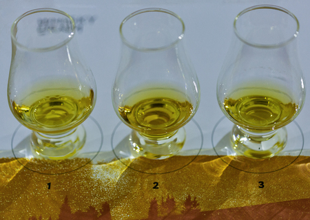 KIEV, UKRAINE - OCTOBER 20, 2018: Tasting whisky glasses closeup in a row at 4th Ukrainian Whisky Dram Festival organized by Good Wine company in Artistic Arsenal.のeditorial素材