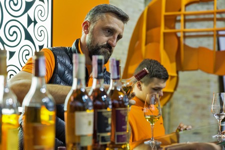 KIEV, UKRAINE - OCTOBER 20, 2018: Bartender works at Glenmorangie Scotch highland single malt whisky booth at 4th Ukrainian Whisky Dram Festival organized by Good Wine company in Artistic Arsenal.のeditorial素材