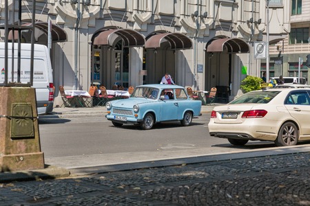 BERLIN, GERMANY - JULY 14,2018: Typical German vintage Trabant car on Gendarmenmarkt square. It is an automobile which was produced in 1957-1990 by former East German car manufacturer VEB.のeditorial素材