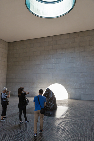 BERLIN, GERMANY - JULY 14, 2018: People visit sculpture Mother with Her Dead Son by K. Kollwitz in Neue Wache. It serves as the Central Memorial of the Germany for the Victims of War and Dictatorship.のeditorial素材