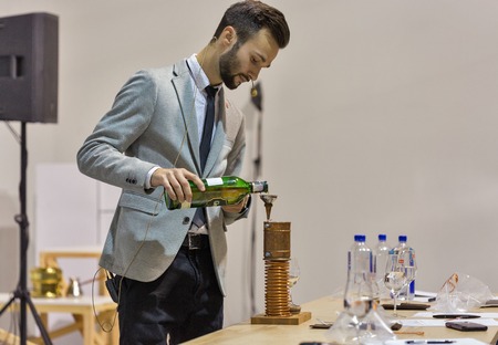 KIEV, UKRAINE - OCTOBER 20, 2018: Man presents Glenfiddich Single Malt Scotch Whisky Highland distillery booth at 4th Ukrainian Whisky Dram Festival organized by Good Wine company in Artistic Arsenal.のeditorial素材