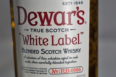 KIEV, UKRAINE - NOVEMBER 11, 2018: Dewar's White Label blended Scotch Whisky closeup. Dewar's whiskies have won more than 400 awards and medals in over 20 countries.のeditorial素材