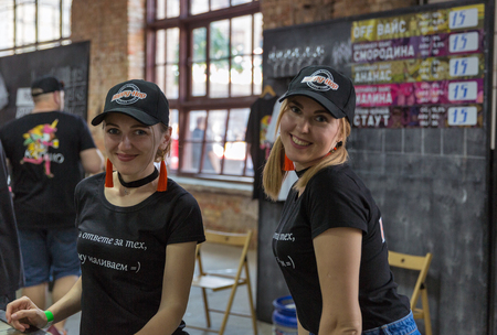 KYIV, UKRAINE - MAY 18, 2019: Bartenders work at Happy-Hop brewery booth during Kyiv Beer Festival vol. 4 in Art Zavod Platforma. More than 60 craft beer breweries were presented here.のeditorial素材