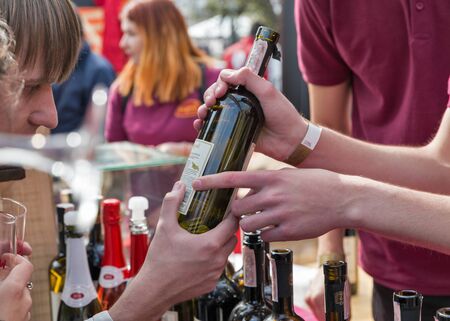 KYIV, UKRAINE - APRIL 21, 2019: Bugeuli Georgian winery booth during Food and Wine Festival in National Expocenter, a permanent multi-purpose exhibition complex.のeditorial素材