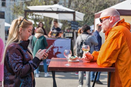 KYIV, UKRAINE - APRIL 21, 2019: People tasting wine during Food and Wine Festival in National Expocenter, a permanent multi-purpose exhibition complex.のeditorial素材