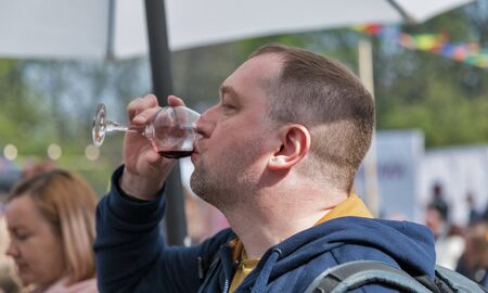 KYIV, UKRAINE - APRIL 21, 2019: People tasting wine during Food and Wine Festival in National Expocenter, a permanent multi-purpose exhibition complex.のeditorial素材