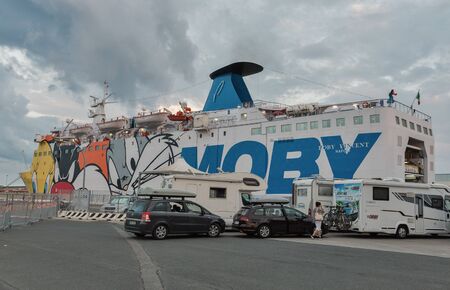 LIVORNO, ITALY - JULY 12, 2019: Early morning loading transport and passengers on a Moby Vincent ferry. Preparing to leave from Livorno port to Bastia in Corsica island.のeditorial素材