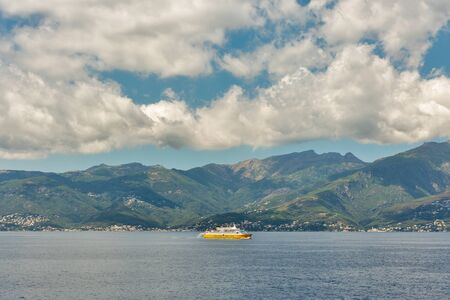 CORSICA, FRANCE - JULY 12, 2019: Corsica Ferries - Sardinia Ferries ship sailing in the sea with dramatic clouds. It is a ferry company that operates traffic to and from Corsica, Sardinia and Elba.のeditorial素材