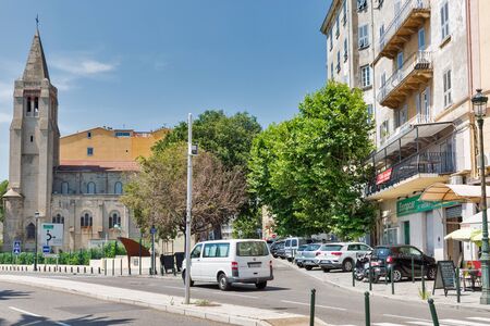 BASTIA, CORSICA, FRANCE - JULY 23, 2019: Pascal Lota avenue with Catholic Church. Bastia is the principal port of island and its principal commercial town with second highest population after Ajaccio.のeditorial素材