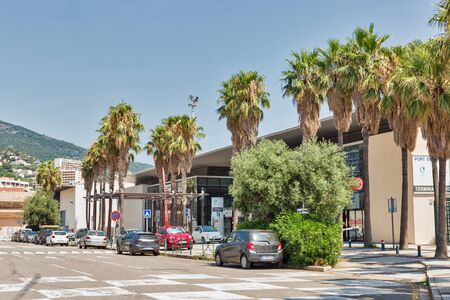 BASTIA, CORSICA, FRANCE - JULY 23, 2019: Cars parked in front of passenger port building, Terminal Nord entrance. The port of Bastia is the busiest French port on the Mediterranean Sea.のeditorial素材