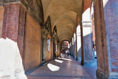 BOLOGNA, ITALY - JULY 10, 2019: Ancient narrow Maggiore street and Church Santi Bartolomeo and Gaetano. Bologna is the capital and largest city of the Emilia-Romagna region.のeditorial素材