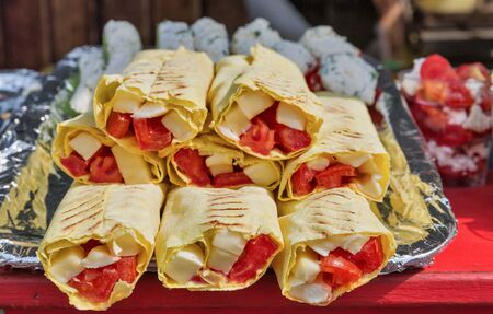 fast food pita bread with cheese and tomatoes closeupの写真素材