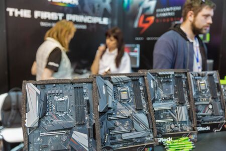 KYIV, UKRAINE - APRIL 06, 2019: ASRock, a Taiwanese company specializes in the production of motherboards since 2002 booth during CEE 2017, the largest consumer electronics trade show of Ukraine.のeditorial素材