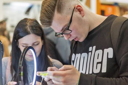 KYIV, UKRAINE - APRIL 13, 2019: People visit Samsung, a South Korean multinational conglomerate corporation booth during CEE 2019, the largest electronics trade show of Ukraine in Tetra Pack EC.のeditorial素材
