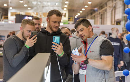 KYIV, UKRAINE - APRIL 13, 2019: People visit Huawei, a Chinese multinational corporation booth...