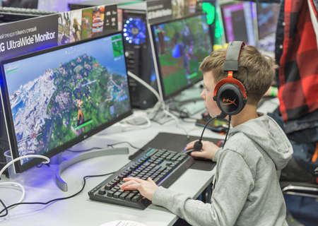 KYIV, UKRAINE - APRIL 13, 2019: Young boy gamer involved in ArtLine tournament in game zone during CEE 2019, the largest consumer electronics trade show of Ukraine in Tetra Pack EC.のeditorial素材