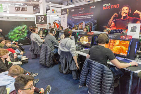 KYIV, UKRAINE - APRIL 13, 2019: Gamers participate in World of Tanks tournament in game zone during...