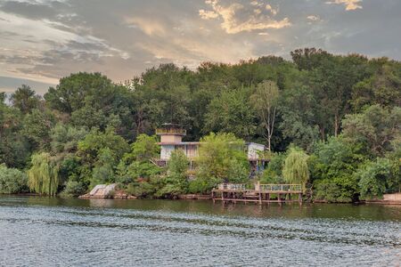 Abandoned building with pier, Dnieper river and Khortytsia island summer landscape, Ukraine. Khortytsia is the largest island in the River Dnieper.の写真素材