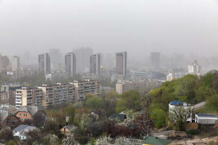 KYIV, UKRAINE - APRIL 16, 2020: Dust storm with strong wind sweeps across Kyiv city during Covid-19...