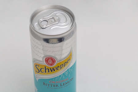 KYIV, UKRAINE - DECEMBER 31, 2019: Schweppes Bitter Lemon Original can closeup against white...