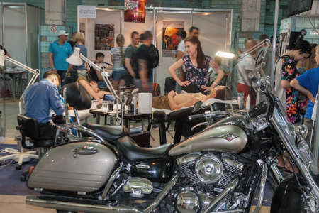 KIEV, UKRAINE - MAY 23, 2015: Tattoo artist works during International Tattoo Convention Kyiv Tattoo Collection 2015 organized by Planeta Tattoo studio in Art-factory Platforma.のeditorial素材