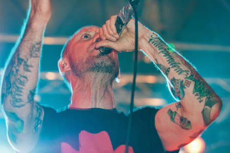 KIEV, UKRAINE - MAY 23, 2015: Sergey Mikhalok front man of punk rock band Brutto performs song during show in International Tattoo Convention Kyiv Tattoo Collection 2015 in Art-factory Platforma.のeditorial素材