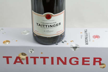 KYIV, UKRAINE - MarchL 28, 2020: Taittinger champagne bottle and box closeup against white background. Taittinger is a French wine family who are famous producers of champagne.のeditorial素材