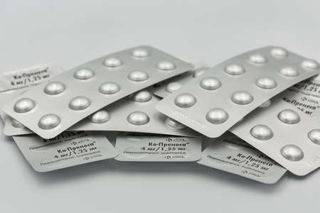 KYIV, UKRAINE - MAY 28, 2020: Antihypertensive drug Co-Prenessa by KRKA, generic perindopril and indapamide blisters closeup against white. Krka is international pharmaceutical company.のeditorial素材