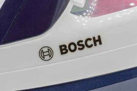 KYIV, UKRAINE - AUGUST 22, 2020: Studio shoot of Bosch Sensixx'x VarioComfort Ceranium Glissee Steam Iron closeup. Robert Bosch GmbH is a German multinational engineering and technology company.のeditorial素材