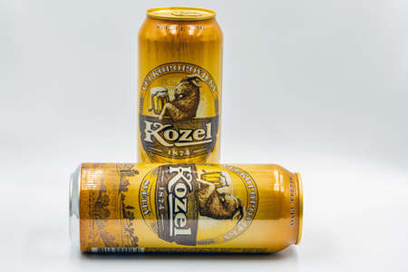 KYIV, UKRAINE - OCTOBER 31, 2020: Studio shoot of Velkopopovicky Kozel Czech light beer cans closeup...