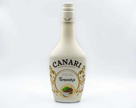 KYIV, UKRAINE - NOVEMBER 14, 2020: Polish Canari Premium Liquer Tiramisu bottle closeup against white background.のeditorial素材