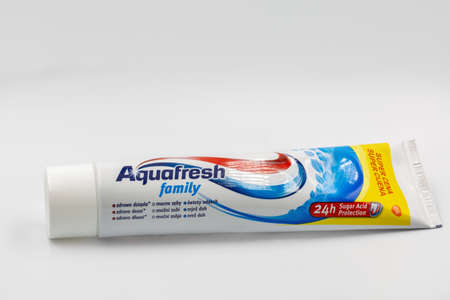KYIV, UKRAINE - NOVEMBER 14, 2020: Aquafresh family fluoride toothpaste tube closeup against white....