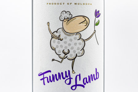 KYIV, UKRAINE - OCTOBER 03, 2020: Studio shoot of Moldavian Funny Lamb Cabernet Sauvignon Merlot selected red dry wine bottle label by Vinuri de Comrat closeup against white background.のeditorial素材