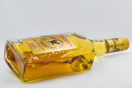 KYIV, UKRAINE - NOVEMBER 28, 2020: Studio shoot of Mexican Tequila Tres Sombreros bottle closeup against white. It is a distilled beverage made from the blue agave plant.のeditorial素材