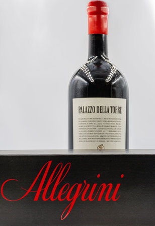 KYIV, UKRAINE - DECEMBER 17, 2020: Studio shoot of box and bottle of Allegrini Italian Palazzo della Torre Veronese red dry wine closeup against white.のeditorial素材