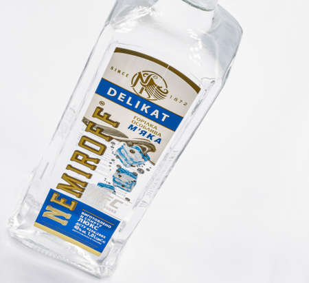 KYIV, UKRAINE - JANUARY 06, 2021: Ukrainian Nemiroff Delicat vodka bottle closeup against white. Nemiroff is an international alcohol brand, one of the world's largest producers of alcohol.のeditorial素材