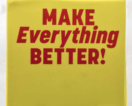 Red positive sign Make Everything Better closeup on yellow backgroundの写真素材