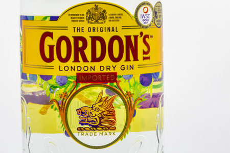 KYIV, UKRAINE - MARCH 27, 2021: The Original Gordons premium London dry gin bottle label closeup against white. Gin is a distilled alcoholic drink that derives its flavour from juniper berries.のeditorial素材