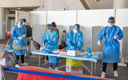 LARNACA, CYPRUS - MAY 22, 2021: Medical team conducts COVID rapid testing of passengers arriving in...